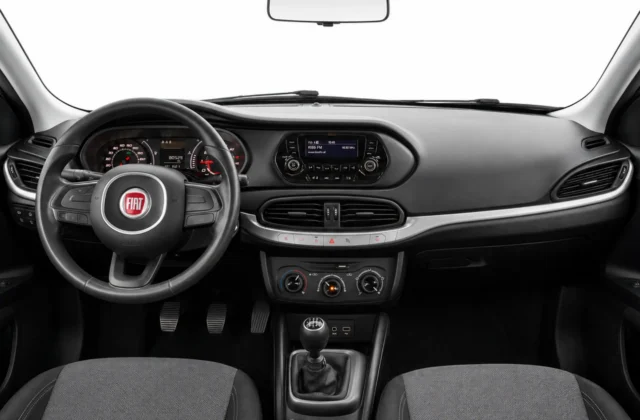Fiat Tipo interior showing the dashboard, manual gearbox and air conditioning controls